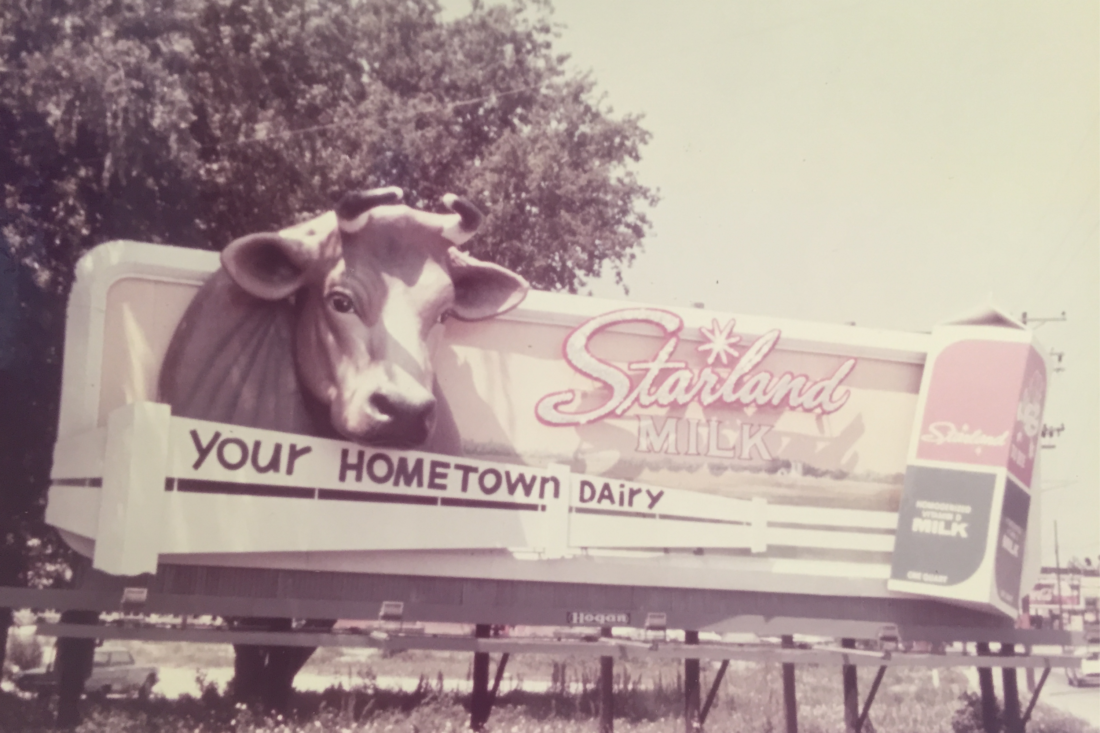 A vintage photo of a dairy billboard