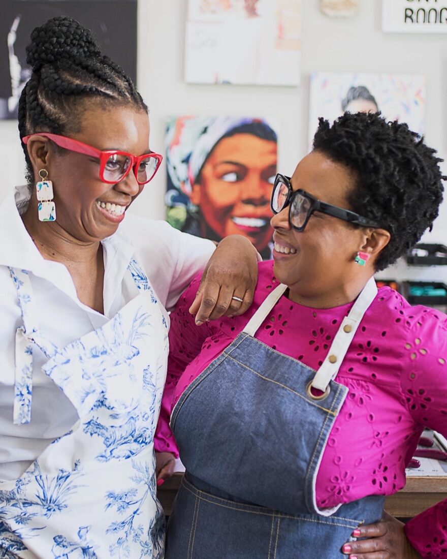 A portrait of two women laughing