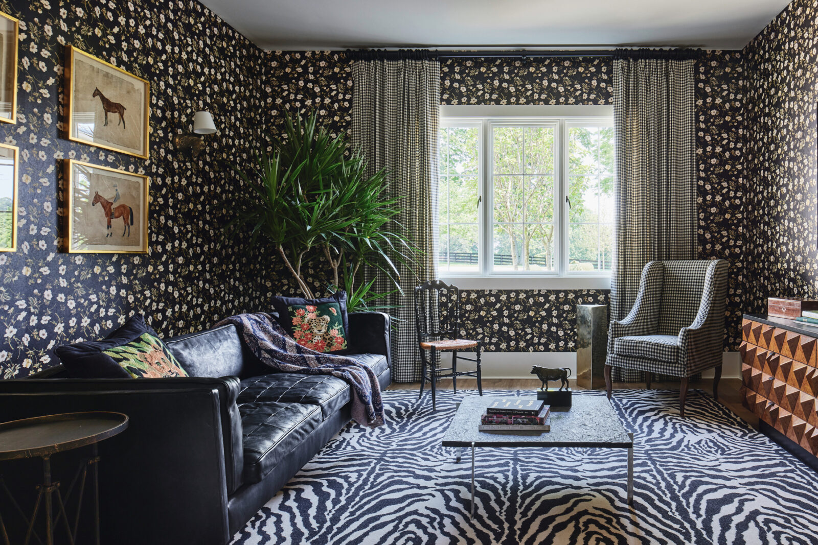 A floral patterned wallpaper in a sitting room