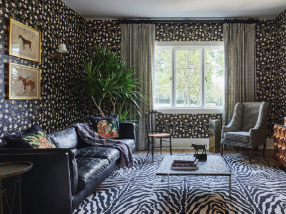A floral patterned wallpaper in a sitting room