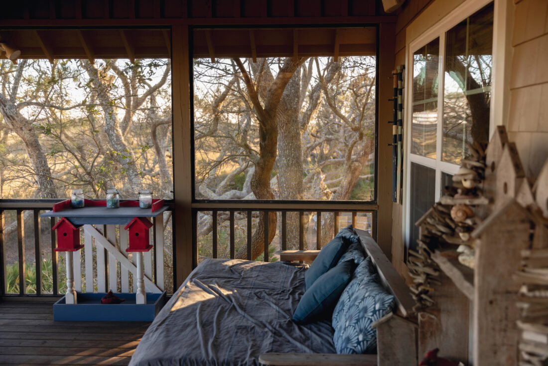 A porch with a daybed