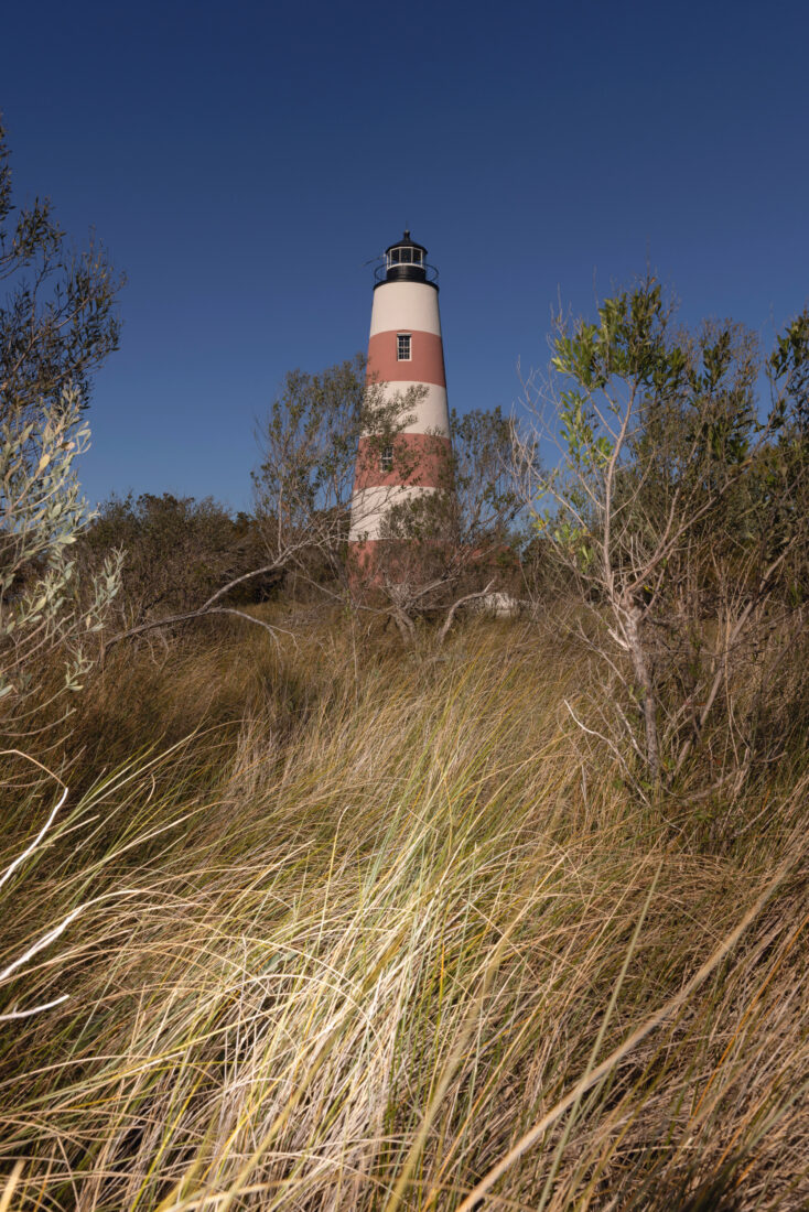 A white and red striped lighthouse