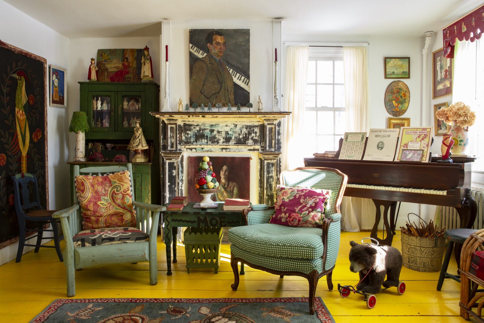 A music room with a yellow floor and green chairs