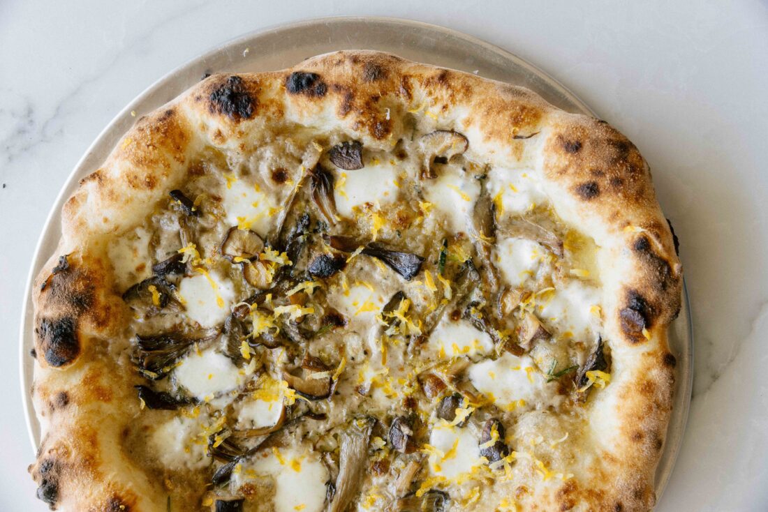 A pizza topped with mushrooms