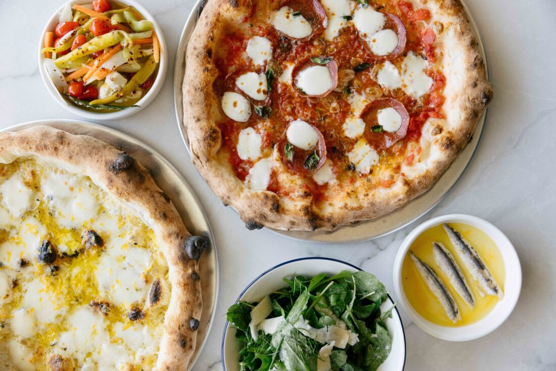 Two pizzas and three side dishes