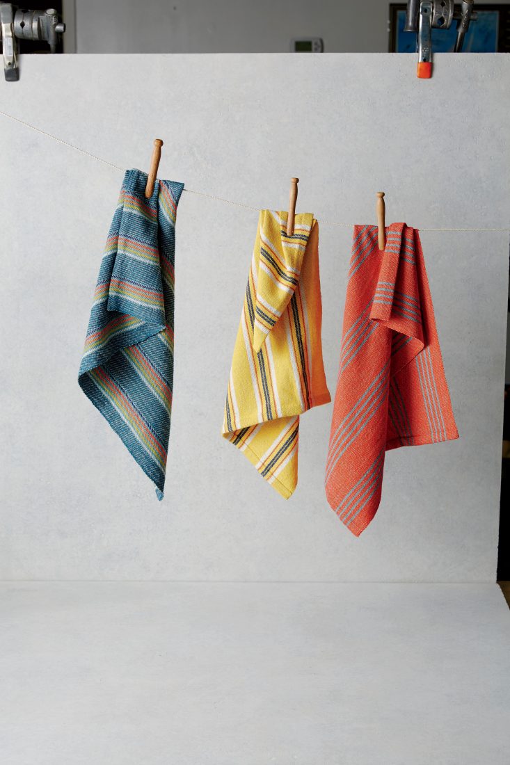 A set of three towels hanging from a line