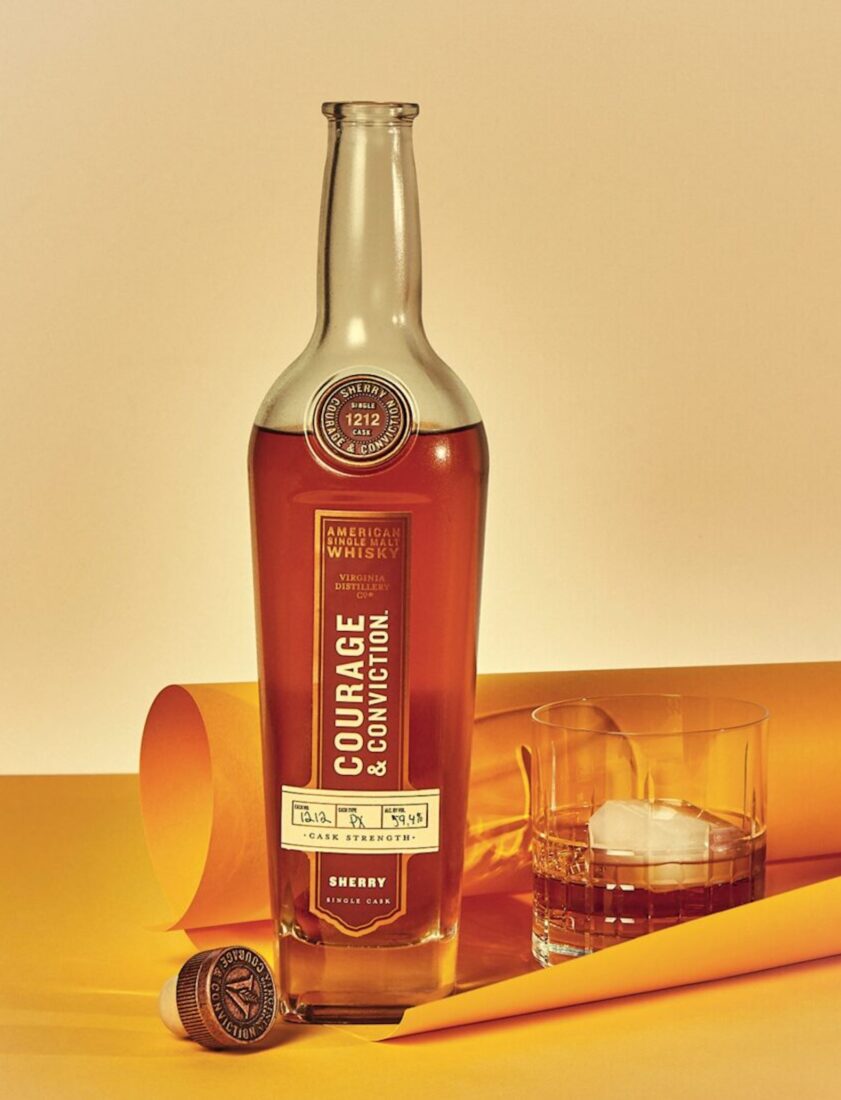 A bottle of whiskey against a yellow background
