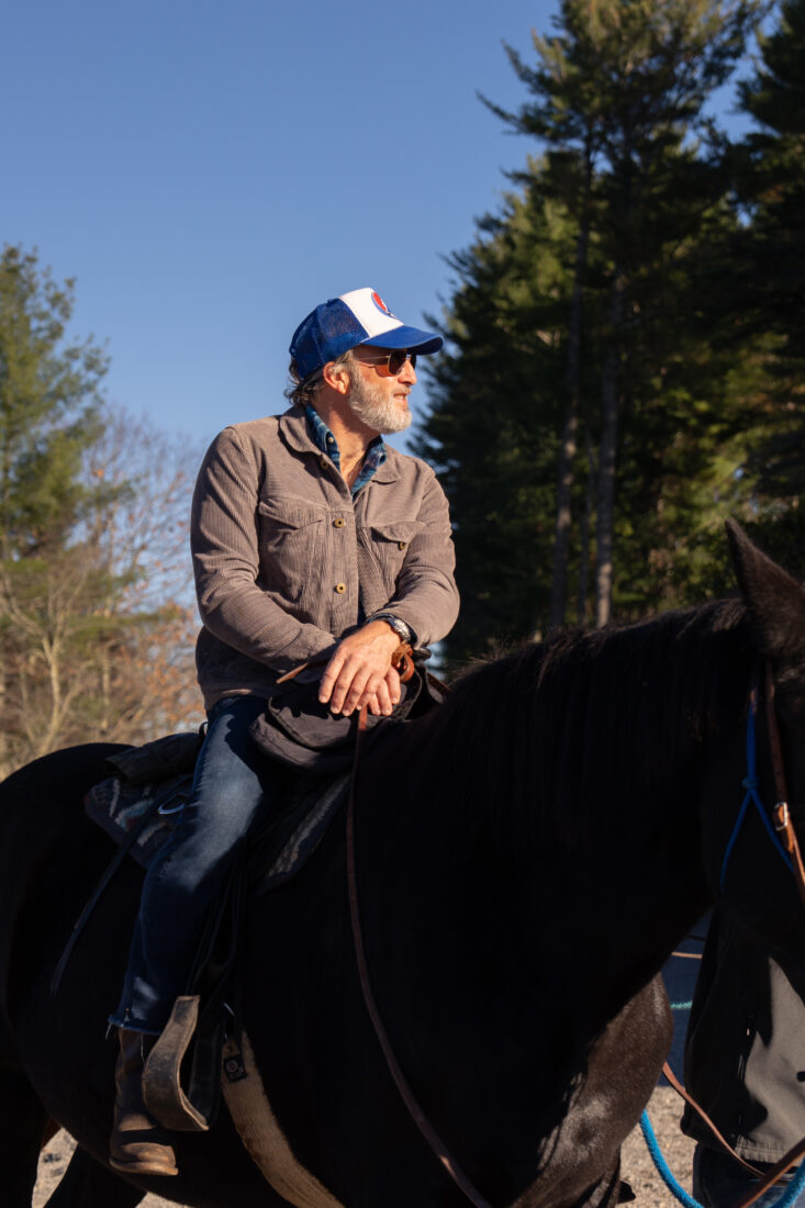 Chas Agosti saddles up for a horse ride.