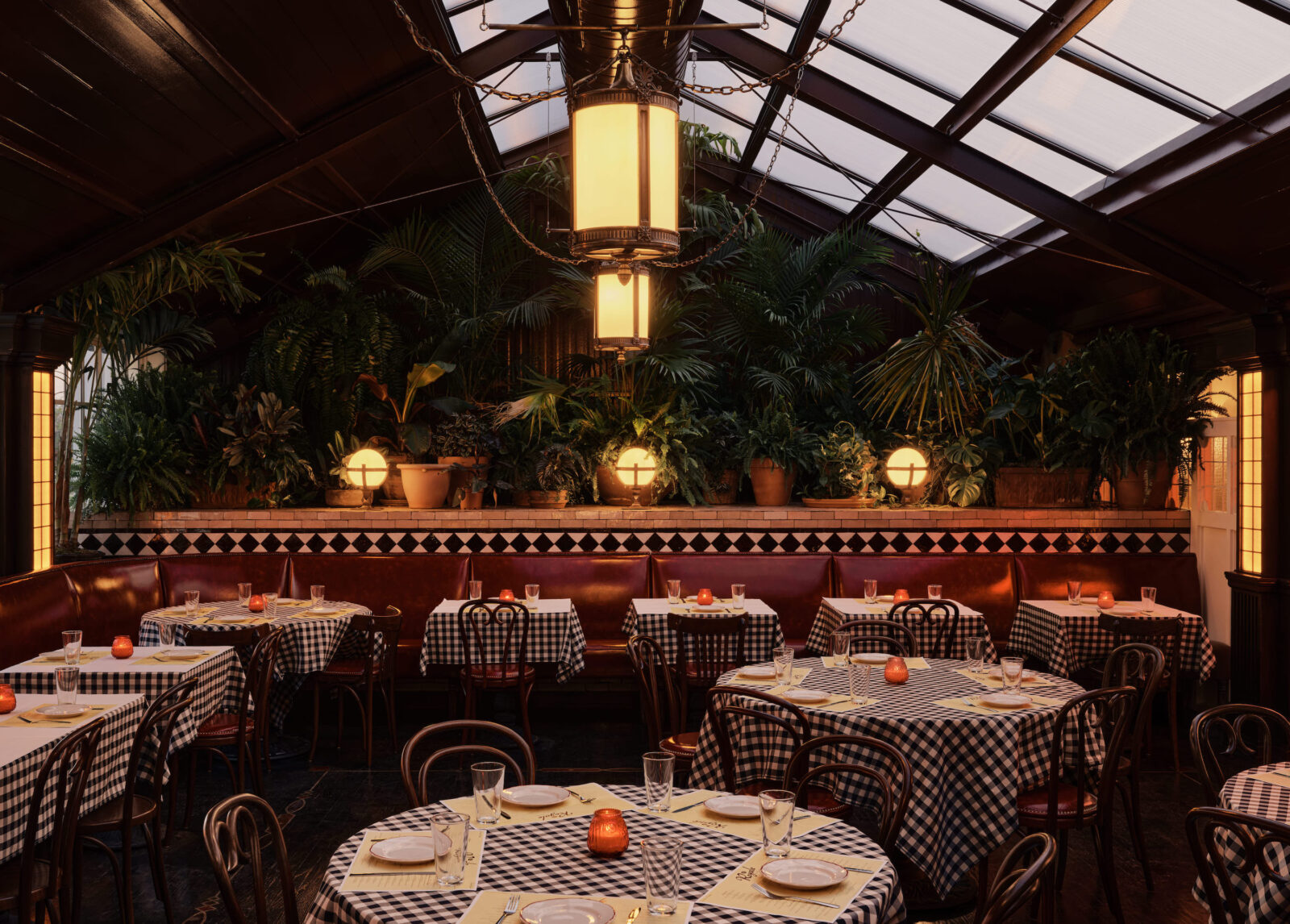 Inside a restaurant with big ceiling windows and checkered tables