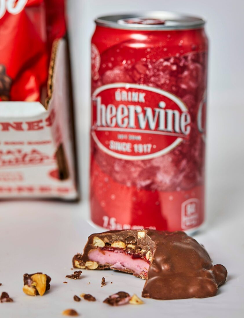 A can of soda and a piece of chocolate candy