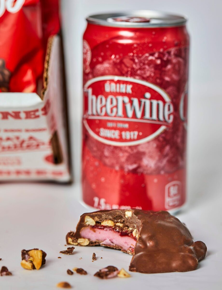 A can of soda and a piece of chocolate candy