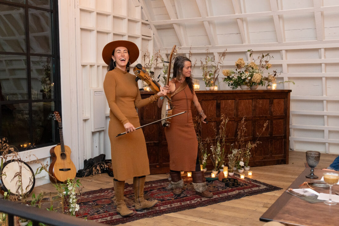 Leah Song and Chloe Smith from Rising Appalachia, an award-winning Asheville-based bluegrass band, close out the evening.