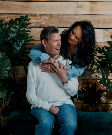 A man and woman hugging and smiling