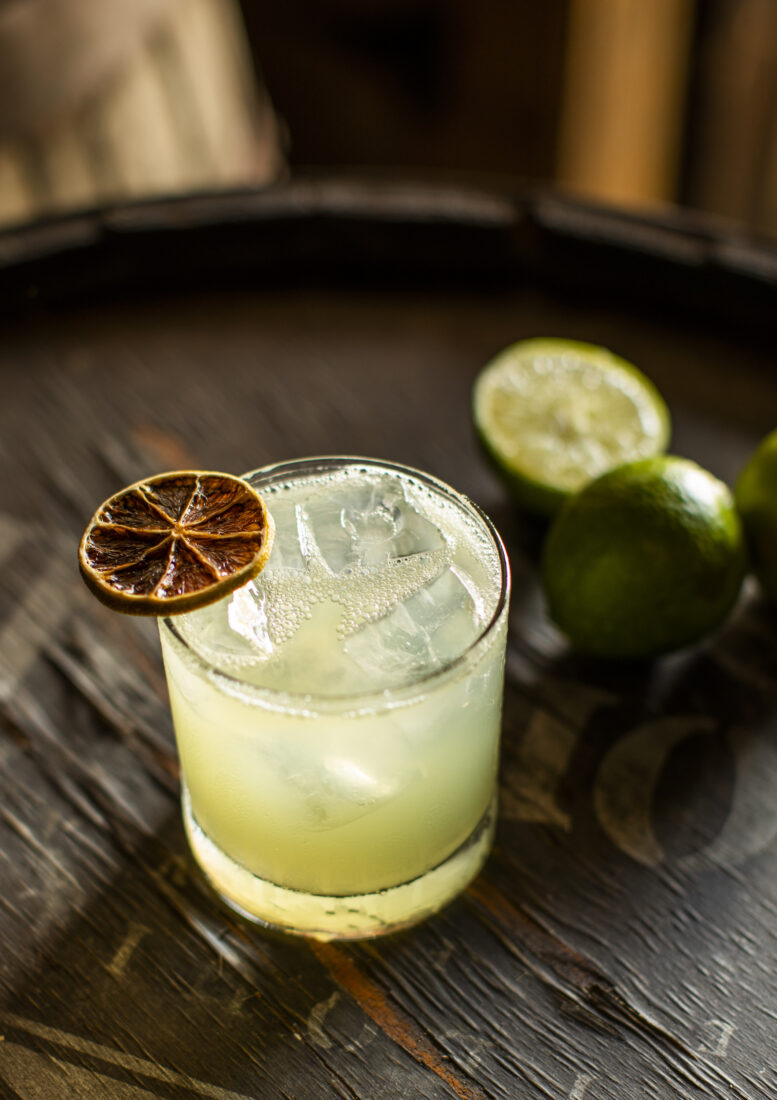 A margarita with a dehydrated lime