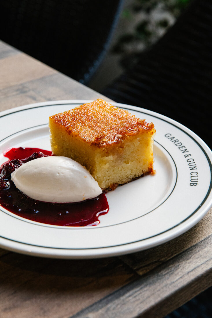 Bruleed Butter Cake with a side of berry compote and orange Chantilly.