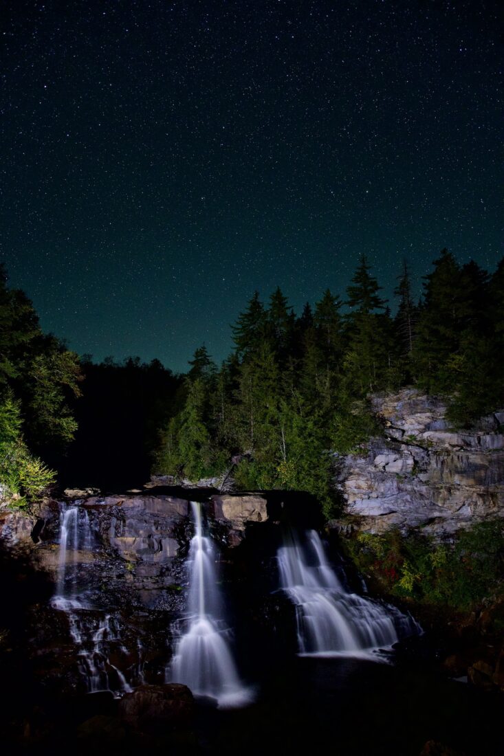 A waterfall at night