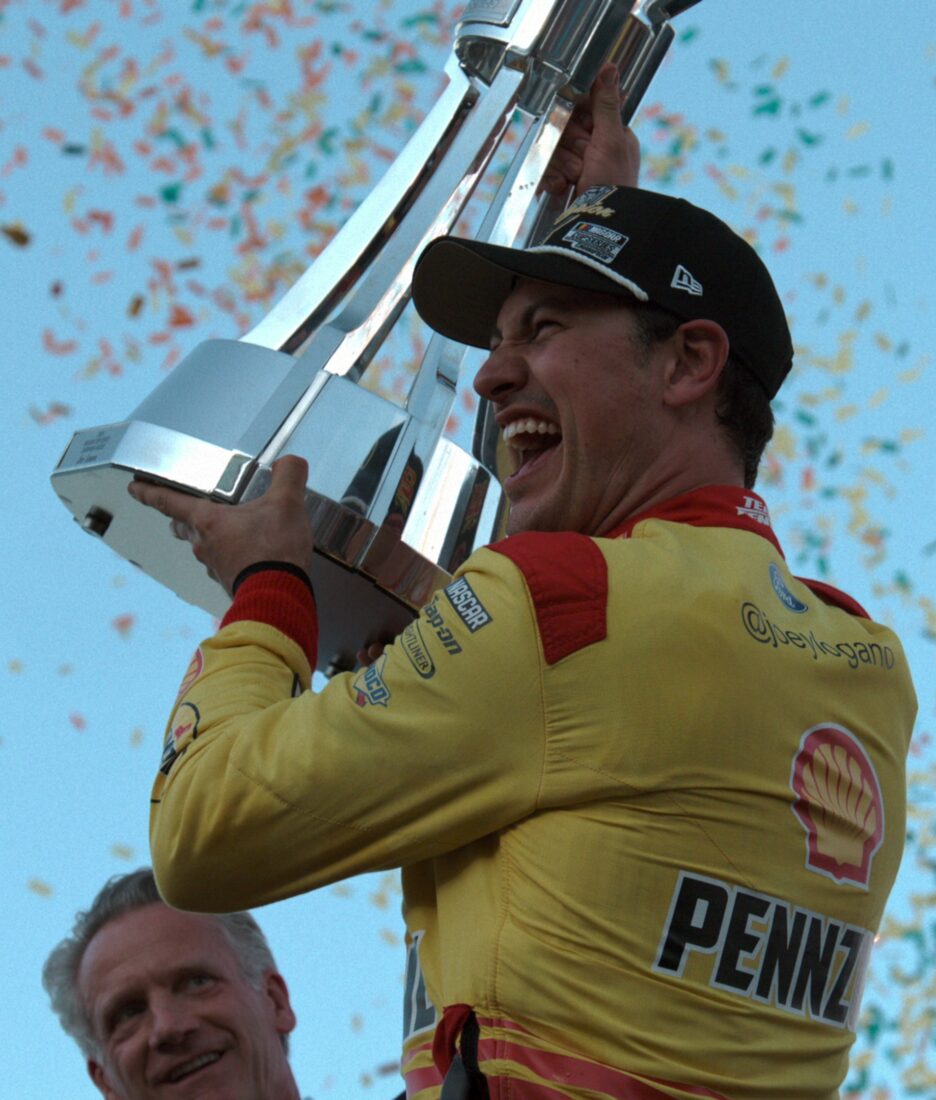 A man holds a trophy