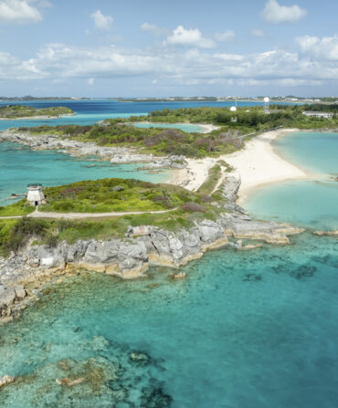 An island with white sand beaches and clear water