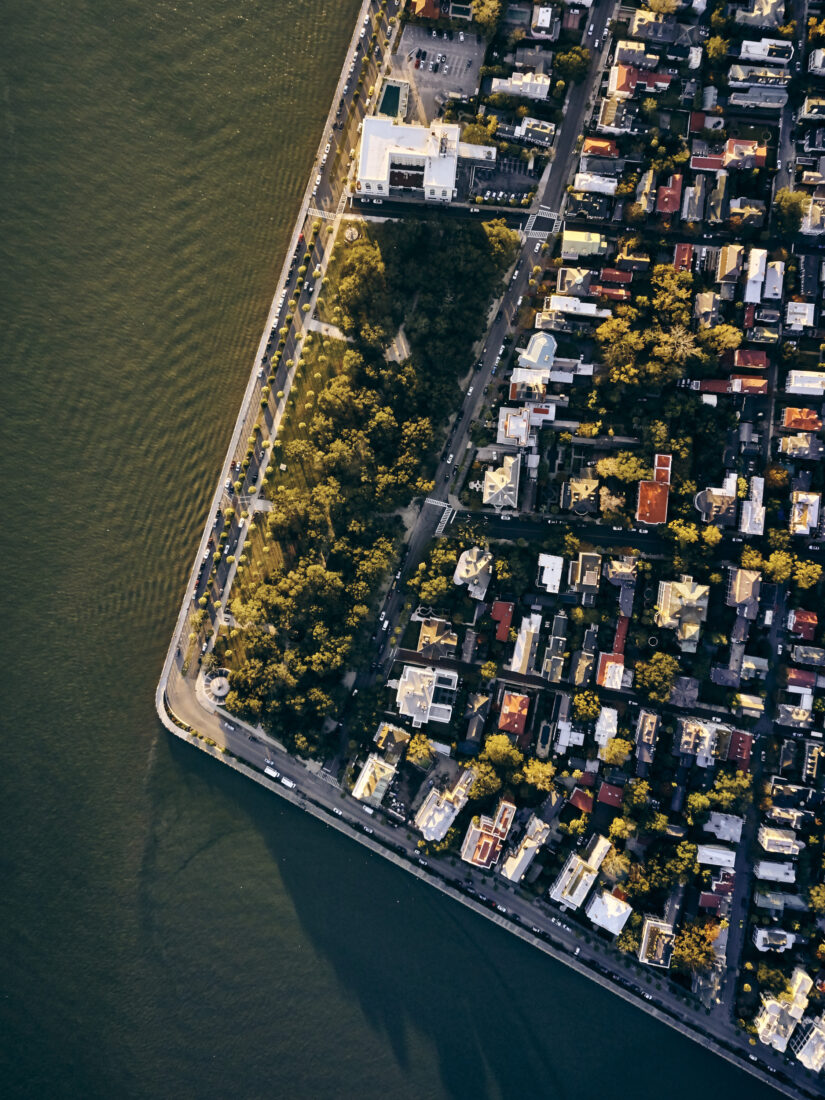An aerial view of a cityscape on the water