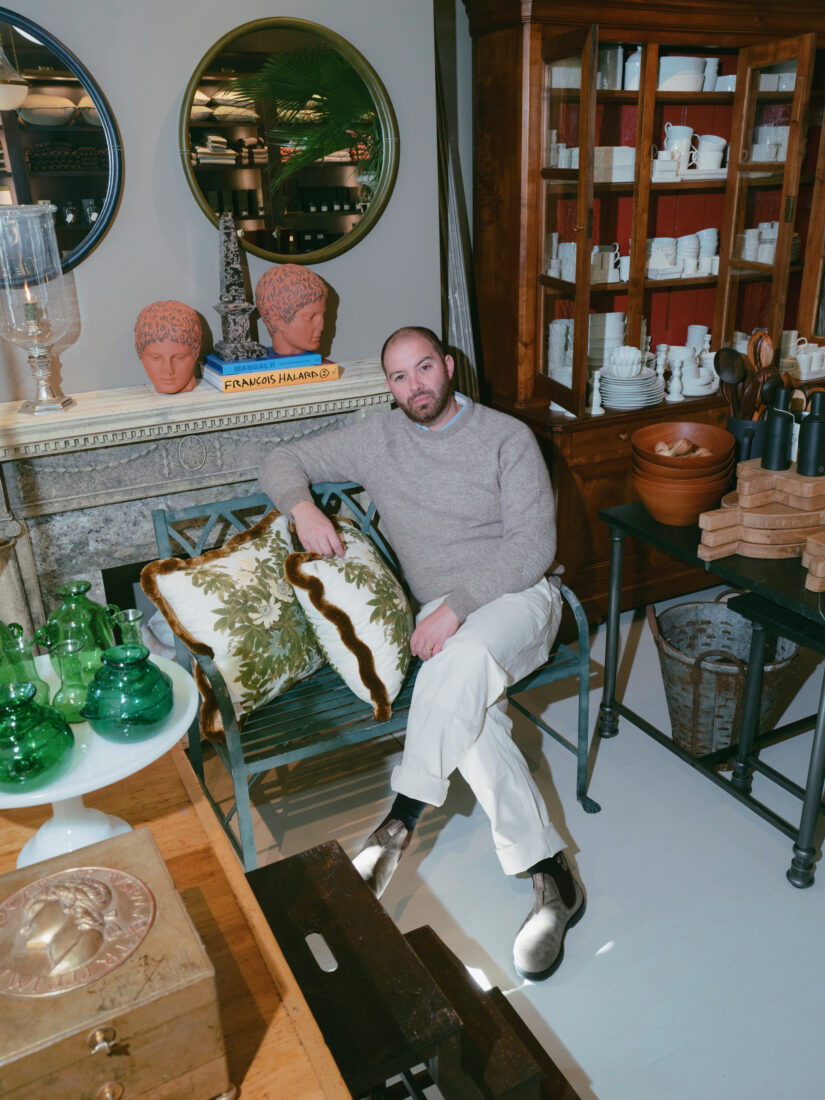 A man sits in a shop