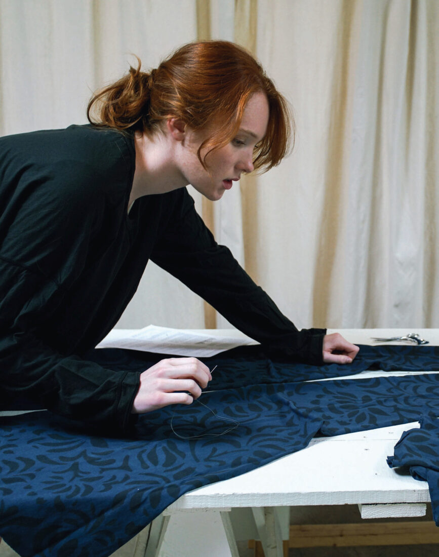 A woman makes a skirt