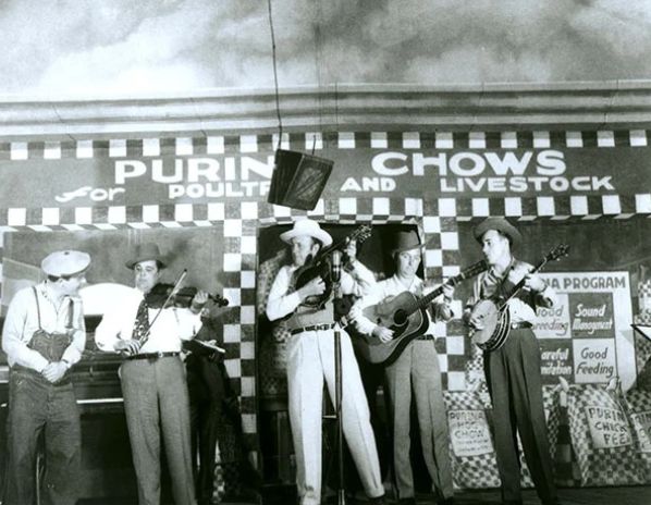 A group of musicians playing onstage