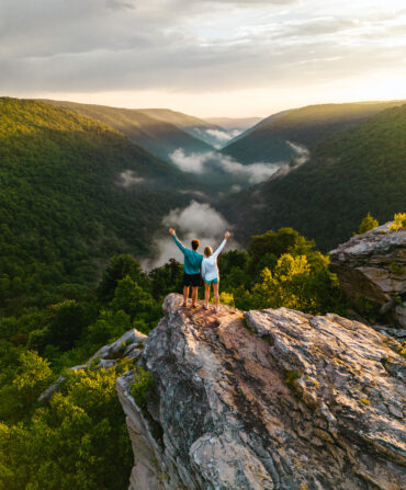 People stand on a rocky outcrop