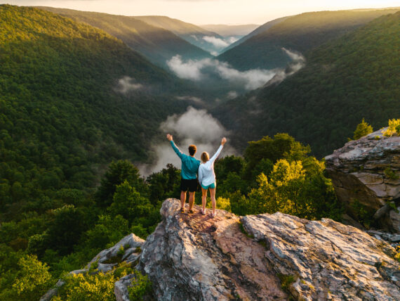 People stand on a rocky outcrop