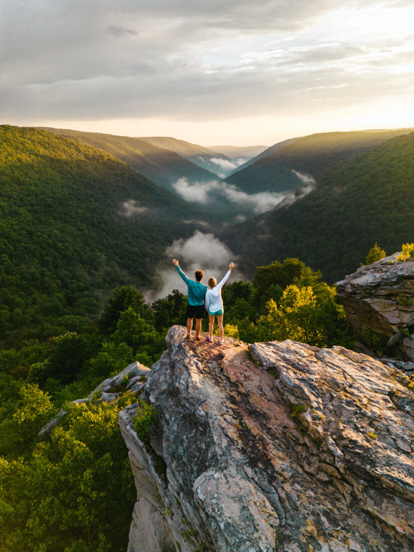 People stand on a rocky outcrop