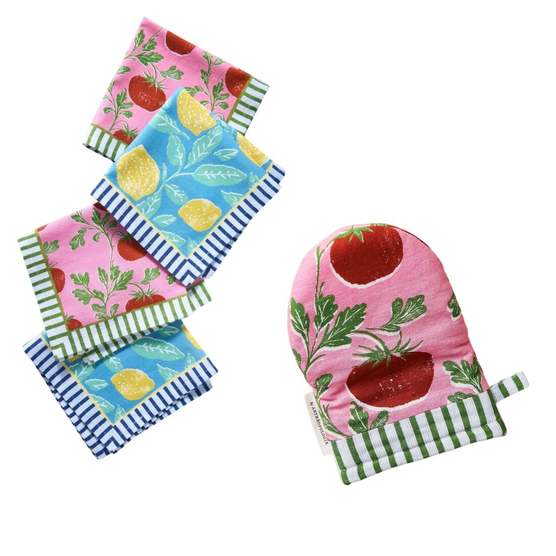 A tomato prink napkin set and oven mitt