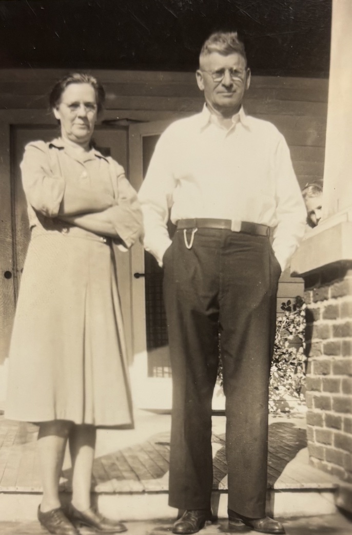 A vintage photo of a couple standing outside