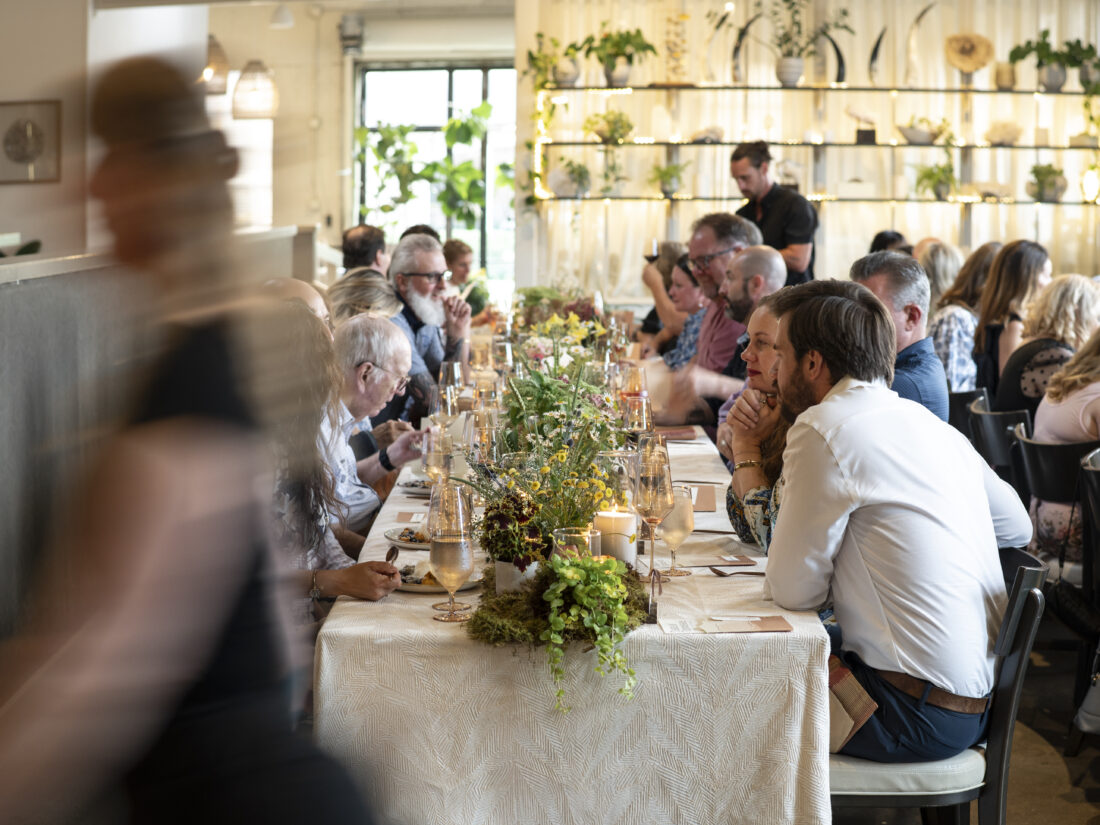 Guests savor the end of a splendid evening with a dessert course of Southern blueberry cobbler made with house biscuits, blueberries, and vanilla bean ice cream.