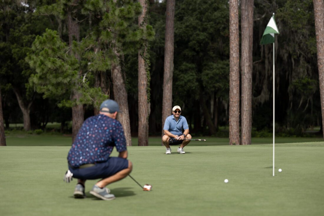 Daniel Navarro and Clint Boyleston analyze their putting strategy.