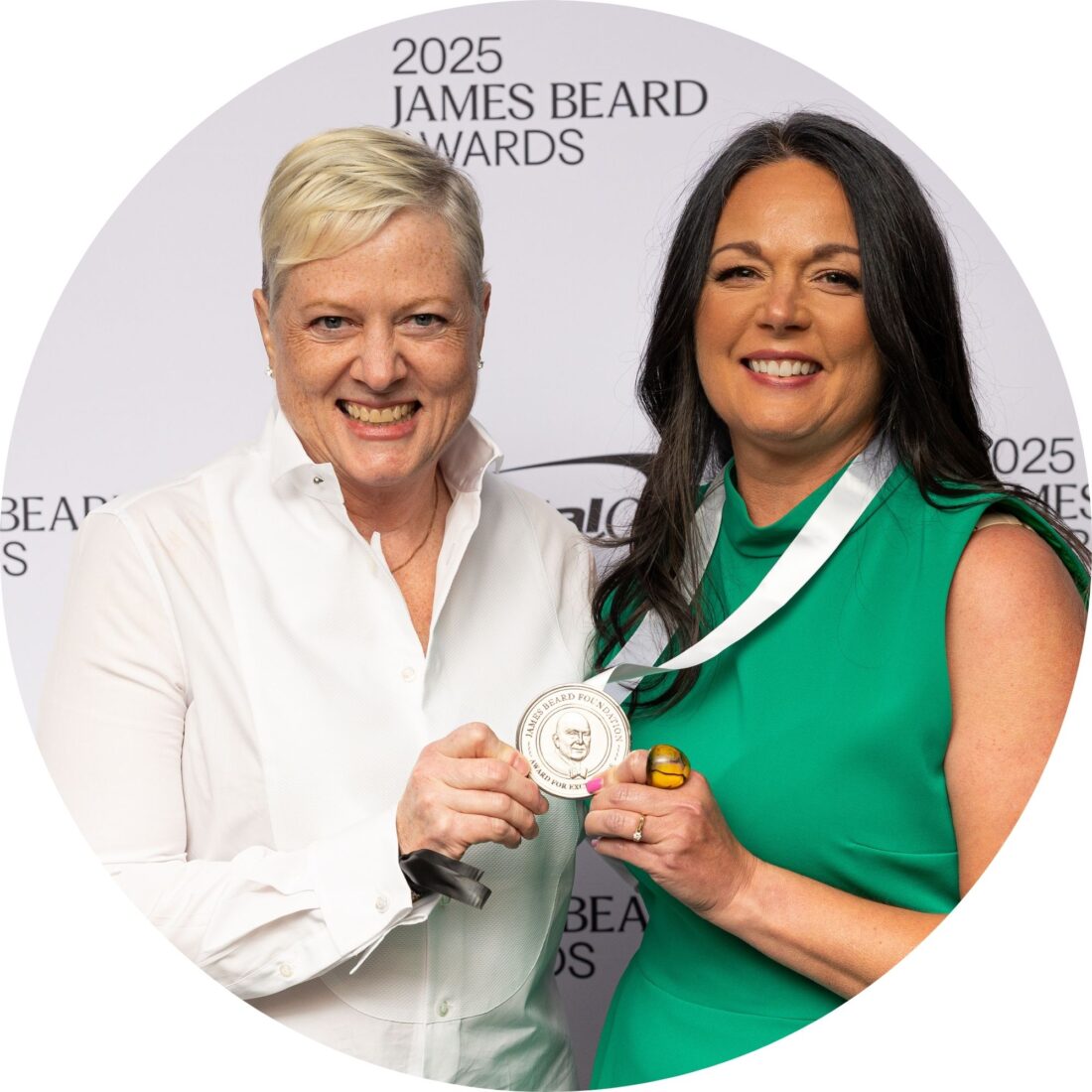 A portrait of two women with a medal