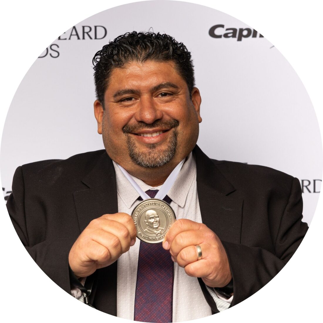 A portrait of a man with a medal
