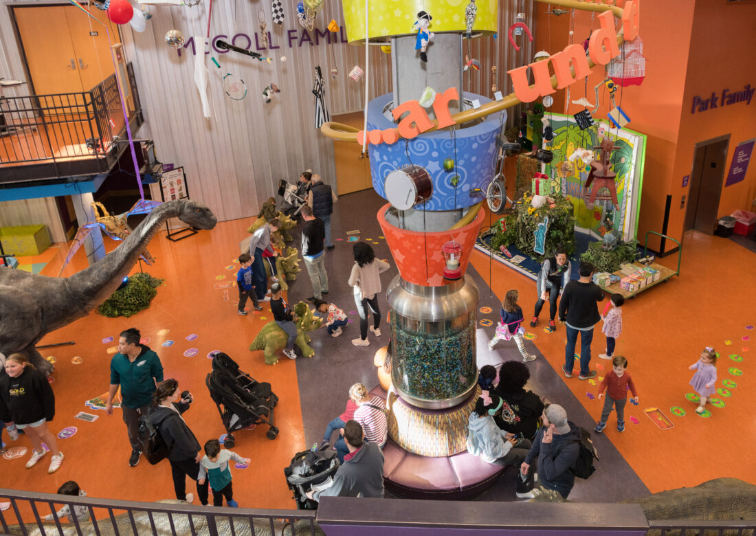 Families playing at a children's library