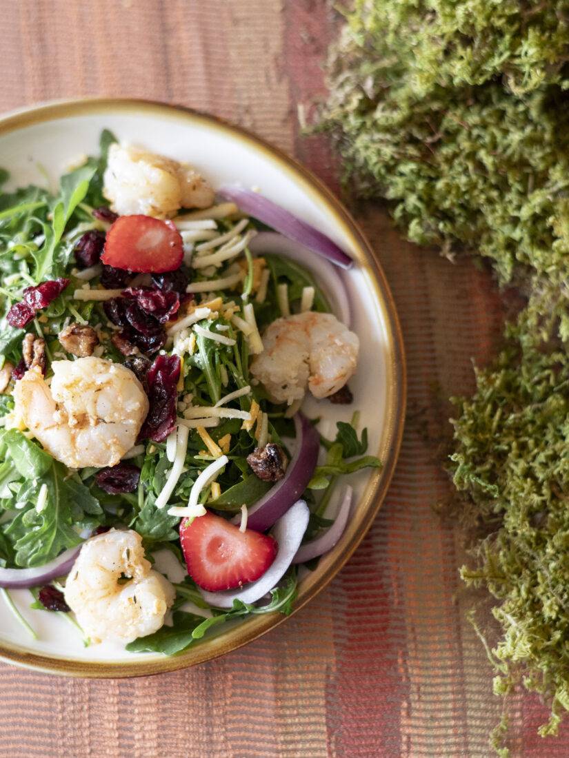 The first course: sweet grilled shrimp salad with arugula, fresh strawberries, and a honey vinaigrette.