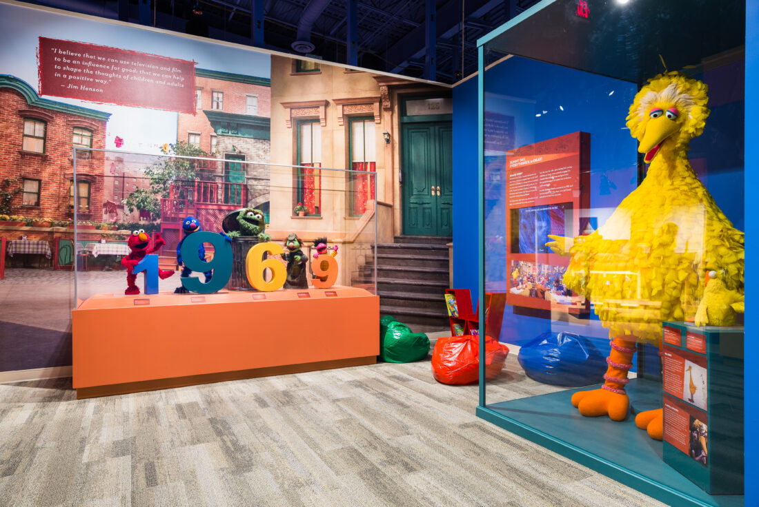 A museum exhibit featuring puppets from Sesame Street
