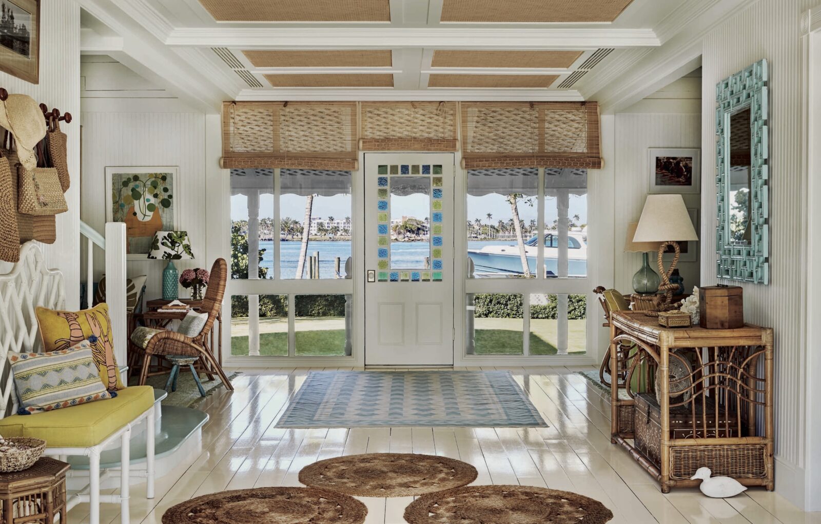 A layered decorated entryway looks to the water