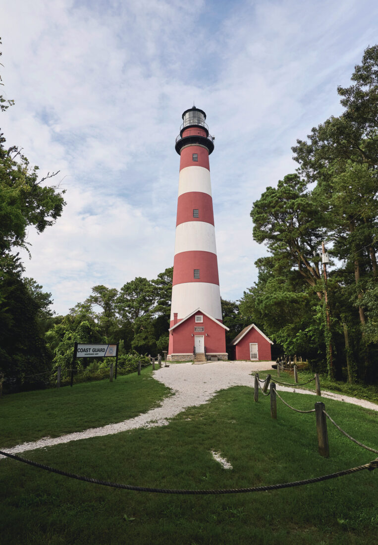 A white and red striped lighthouse