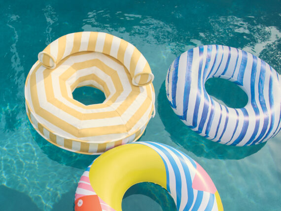 A collection of three pool floats