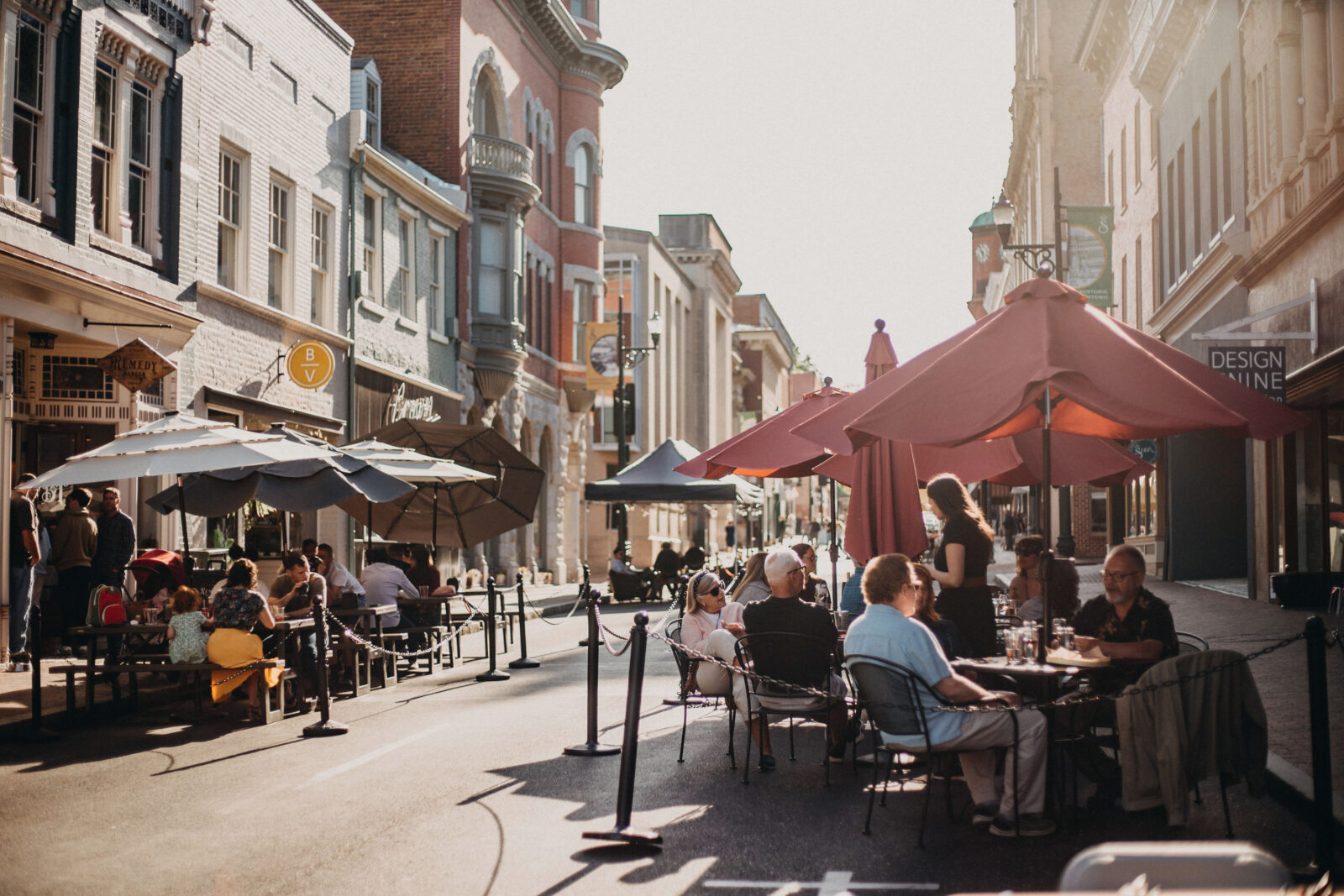 A street with outdoor dining in a downtown