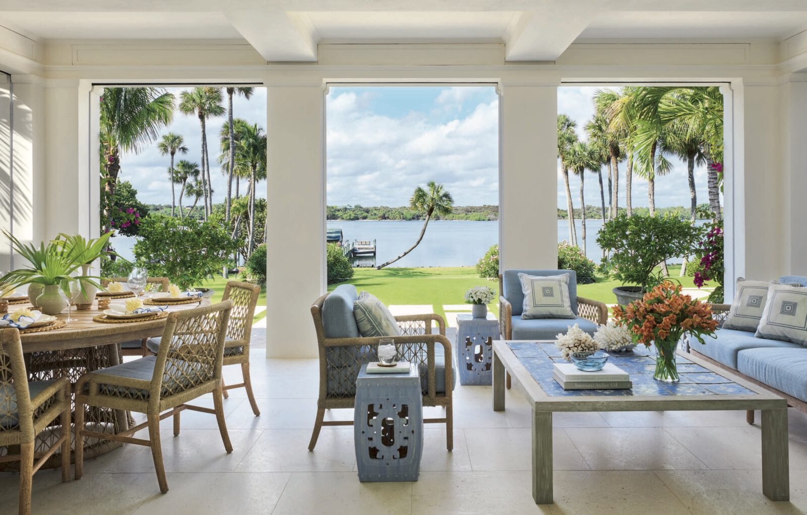 A white patio with a tile table