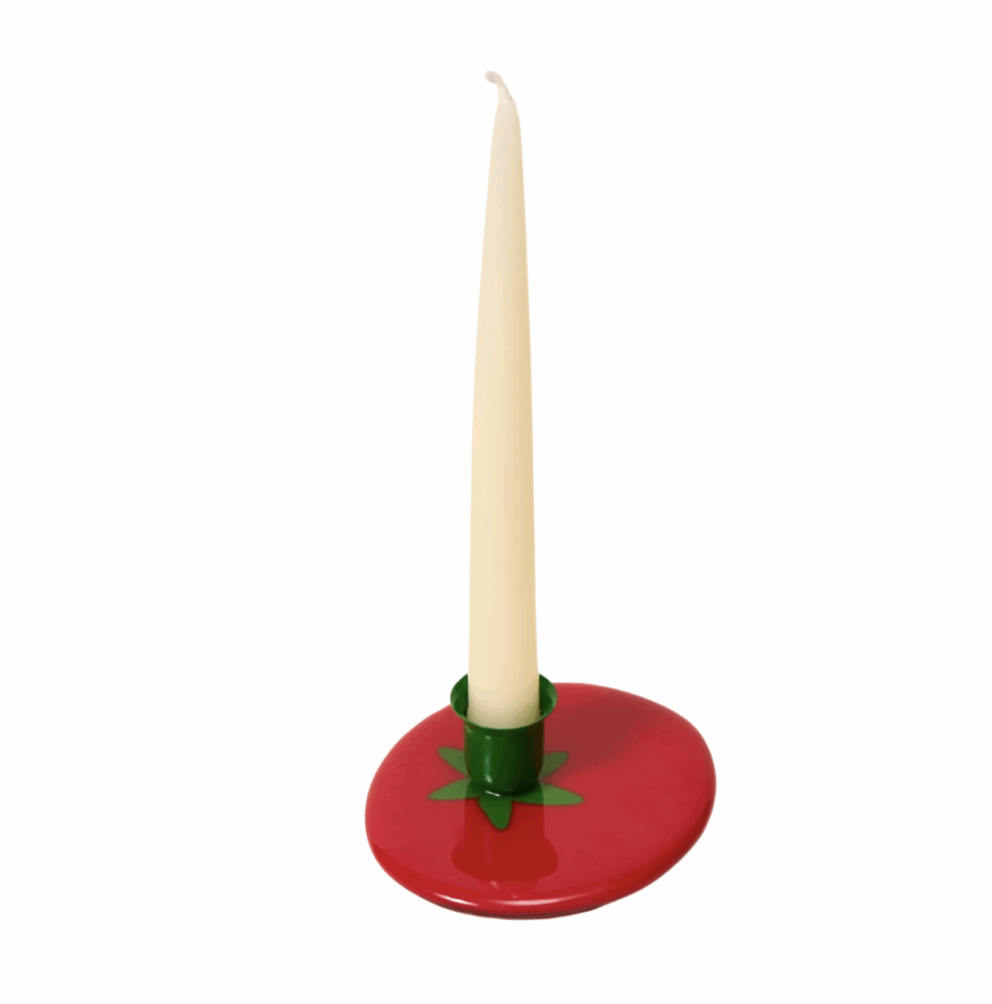 A tomato taper candle holder