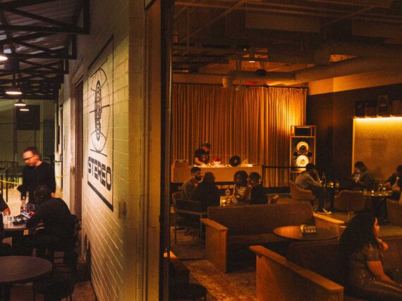 A listening bar with dark, warm lights and a moody feel