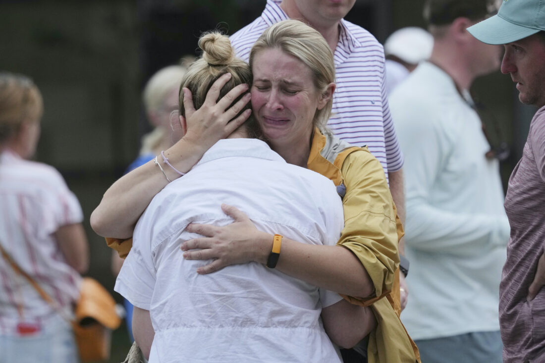 Two women embrace