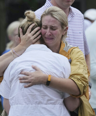 Two women embrace