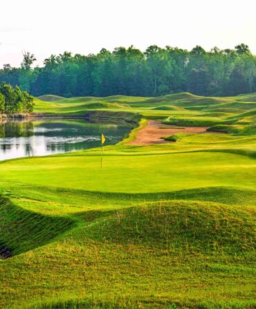 A golf course with a pond