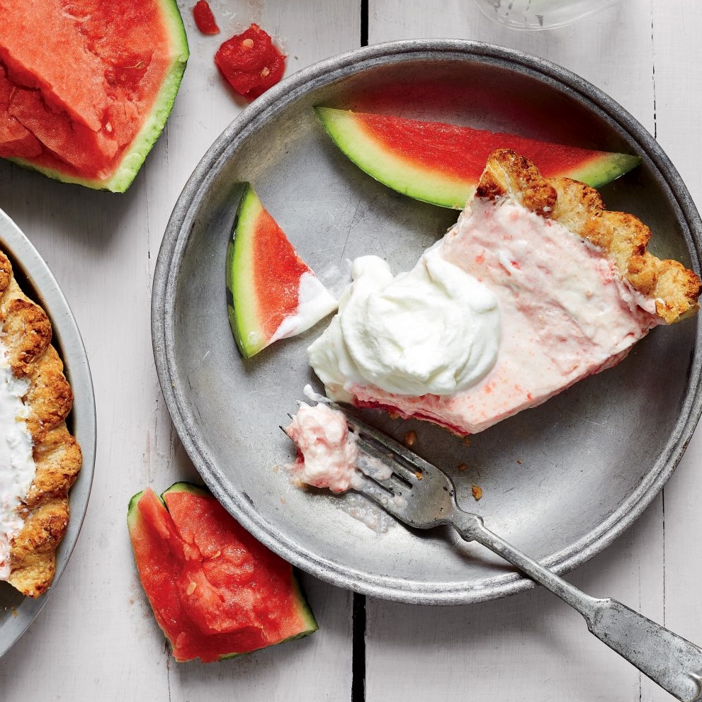 a silver plate with watermelon chiffon pie and whipped cream