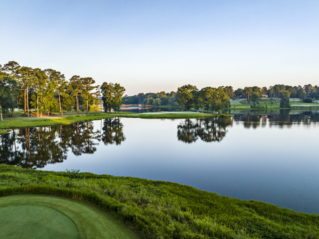 A golf course by a body of water